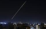 A long exposure shows a light trail from a projectile fired from Gaza City at Israel as the IDF launched air strikes on the Hamas-run Palestinian enclave early on January 27, 2023. (Mohammed Abed / AFP)