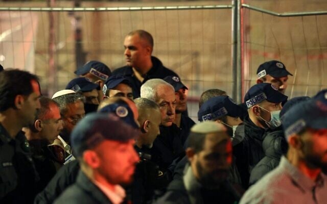 Prime Minister Benjamin Netanyahu visits the scene of a deadly terror shooting in Jerusalem's Neve Yaakov neighborhood, January 27, 2023. (Ahmad Gharabli/AFP)