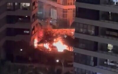 Two cars go up in flames following an explosion in the coastal city of Netanya, January 23, 2023. (Courtesy)