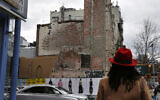 Senior Minister Rev. Jacqueline Lewis, right, looks up at the burned remains of Middle Collegiate Church on April 10, 2022  (AP Photo/Jessie Wardarski)