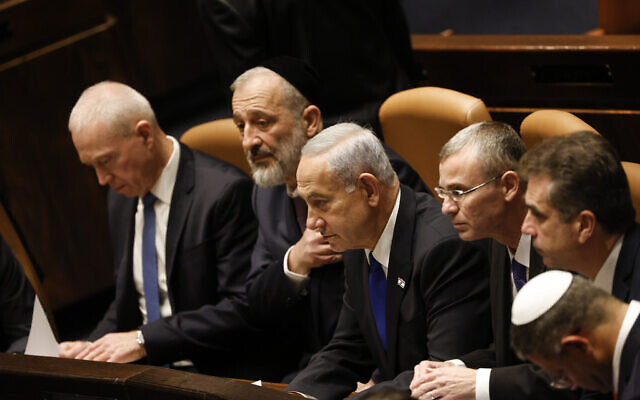 Prime Minister Benjamin Netanyahu, center, and members of his new government look on as the government is sworn in at the Knesset, Thursday, Dec. 29, 2022, in Jerusalem. (Amir Cohen/Pool via AP) Prime Minister Benjamin Netanyahu, center, and members of his new government look on as the government is sworn in at the Knesset, Thursday, Dec. 29, 2022, in Jerusalem. (Amir Cohen/Pool via AP)