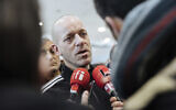 Palestinian French-lawyer and activist Salah Hamouri talks to reporters as he arrives at Charles de Gaulle Airport in Paris after his extradition from Israel to France, Dec. 18, 2022. (AP Photo/Lewis Joly)