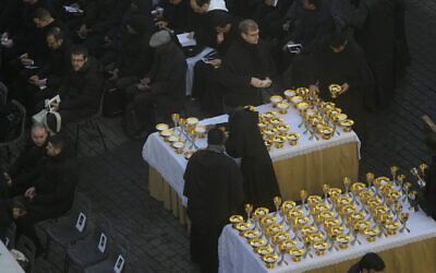 Holy communion vessels are prepared ahead of the funeral mass for late Pope Emeritus Benedict XVI in St. Peter's Square at the Vatican, January 5, 2023. (Ben Curtis/AP)