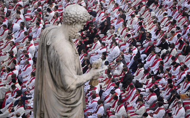 Faithful attend the funeral mass for late Pope Emeritus Benedict XVI in St. Peter's Square at the Vatican, January 5, 2023. (AP Photo/Ben Curtis)