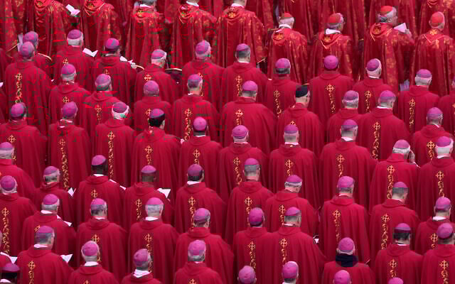 Members of the church attend the funeral mass for late Pope Emeritus Benedict XVI in St. Peter's Square at the Vatican, Thursday, Jan. 5, 2023. Benedict died at 95 on Dec. 31 in the monastery on the Vatican grounds where he had spent nearly all of his decade in retirement. (AP Photo/Ben Curtis)