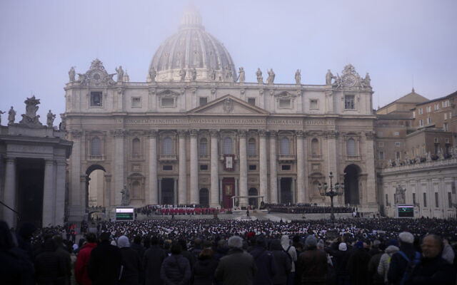 Pope Francis, centre, starts a funeral mass as the coffin of late Pope Emeritus Benedict XVI is placed at St. Peter's Square at the Vatican, Thursday, Jan. 5, 2023. Benedict died at 95 on Dec. 31 in the monastery on the Vatican grounds where he had spent nearly all of his decade in retirement, his days mainly devoted to prayer and reflection. (AP Photo/Domenico Stinellis)