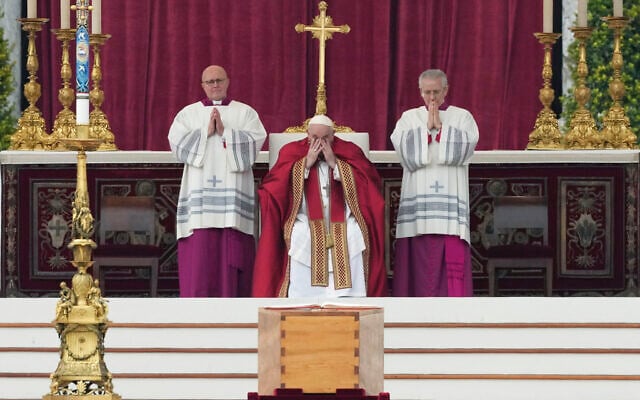 Pope Francis, centre, attends a funeral mass next to the coffin of late Pope Emeritus Benedict XVI St. Peter's Square at the Vatican, Thursday, Jan. 5, 2023. Benedict died at 95 on Dec. 31 in the monastery on the Vatican grounds where he had spent nearly all of his decade in retirement. (AP Photo/Alessandra Tarantino)