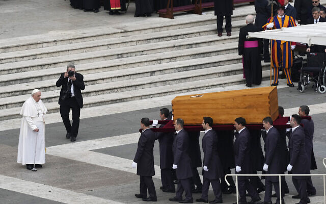 Pope Francis stands next to the coffin of late Pope Emeritus Benedict XVI after a funeral mass at St. Peter's Square at the Vatican, Thursday, Jan. 5, 2023. Benedict died at 95 on Dec. 31 in the monastery on the Vatican grounds where he had spent nearly all of his decade in retirement, his days mainly devoted to prayer and reflection. (AP Photo/Antonio Calanni)