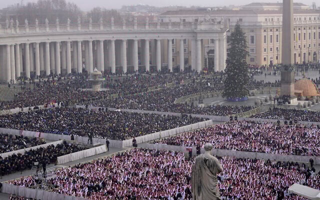 Faithful attend the funeral mass for late Pope Emeritus Benedict XVI in St. Peter's Square at the Vatican, Thursday, Jan. 5, 2023. Benedict died at 95 on Dec. 31 in the monastery on the Vatican grounds where he had spent nearly all of his decade in retirement. (AP Photo/Ben Curtis)
