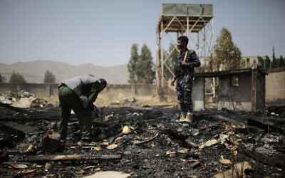 File: Yemeni police inspect a site of Saudi-led airstrikes targeting two houses in Sanaa, Yemen, March 26, 2022 (AP Photo/Hani Mohammed)