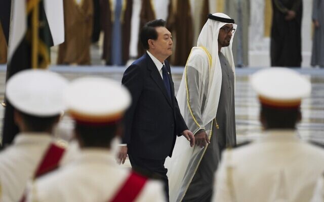 South Korean President Yoon Suk Yeol, center left, and Emirati leader Sheikh Mohammed bin Zayed Al Nahyan walk past an honor guard at Qasar Al Watan in Abu Dhabi, United Arab Emirates, Jan. 15, 2023. (AP Photo/Jon Gambrell) South Korean President Yoon Suk Yeol, center left, and Emirati leader Sheikh Mohammed bin Zayed Al Nahyan walk past an honor guard at Qasar Al Watan in Abu Dhabi, United Arab Emirates, Jan. 15, 2023. (AP Photo/Jon Gambrell)