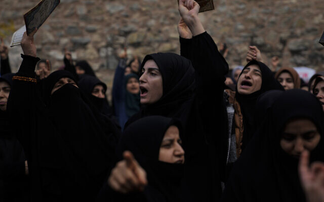 Women chant slogans during a protest outside the Swedish consulate in Istanbul, Turkey, Sunday, January 22, 2023. (AP Photo/Khalil Hamra)