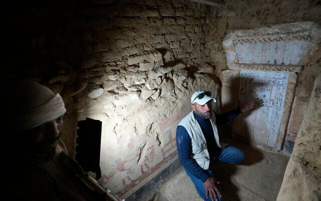 An Egyptian archeologist speaks at a recently discovered tomb dated to the Old Kingdom, 2700–2200 BCE, at the site of the Step Pyramid of Djoser in Saqqara, southwest of Cairo, Egypt, January 26, 2023. (Amr Nabil/AP)