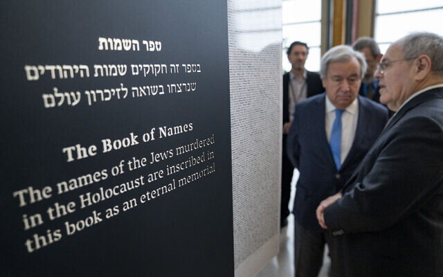 Antonio Guterres, United Nations Secretary General, center, and Dani Dayan, Chairman of Yad Vashem, far right, look at the Yad Vashem Book of Names of Holocaust Victims Exhibit, Thursday, Jan. 26, 2023, at United Nations headquarters. (AP Photo/John Minchillo) Antonio Guterres, United Nations Secretary General, center, and Dani Dayan, Chairman of Yad Vashem, far right, look at the Yad Vashem Book of Names of Holocaust Victims Exhibit, Thursday, Jan. 26, 2023, at United Nations headquarters. (AP Photo/John Minchillo)