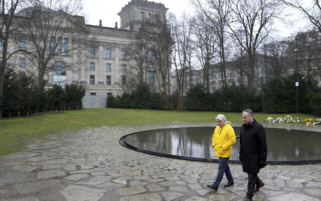 The Second Gentleman of the United States, Douglas Emhoff, right, and Mehmet Daimaguler, left, antiziganism commissioner of the German government, leave after a visit at the memorial to the victims of the Sinti and Roma communities killed during the Holocaust in Berlin, Germany, January 31, 2023. (Michael Sohn/AP)