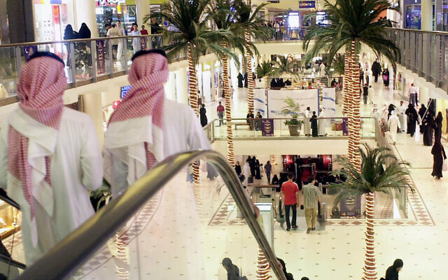 Saudis stroll in a  shopping mall in Riyadh, Saudi Arabia, on  October 31, 2003. Nightlife picks up during the Islamic holy month of Ramadan, with families heading to shopping malls, restaurants and visiting friends and relatives homes after breaking the daylong fast. (AP Photo/Hasan Jamali)