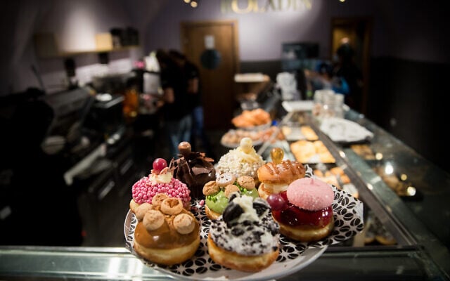 Israeli doughnuts sold at the Roladin bakery outside the Mahane Yehuda market in Jerusalem, on December 7, 2020. (Yonatan Sindel/Flash90)
