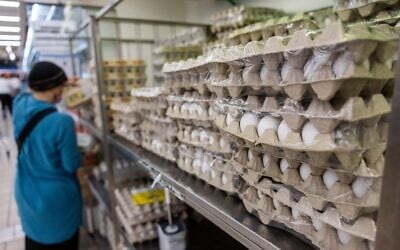 Eggs stacked on shelves at the Osher Ad supermarket in Givat Shaul, Jerusalem, October 27, 2021. (Yonatan Sindel/Flash90)
