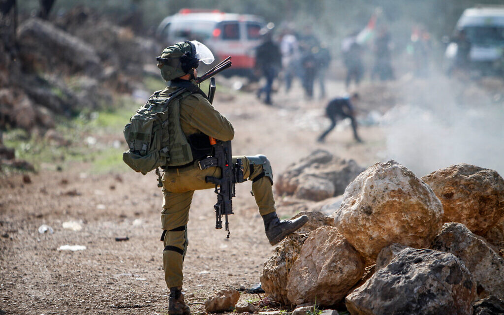 Illustrative: Palestinians clash with Israeli security forces during a protest in the village of Beit Dajan, in the West Bank, on December 9, 2022. (Nasser Ishtayeh/Flash90) Illustrative: Palestinians clash with Israeli security forces during a protest in the village of Beit Dajan, in the West Bank, on December 9, 2022. (Nasser Ishtayeh/Flash90)