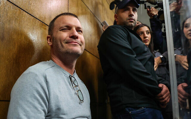 Israeli modeling agent Shai Avital, who was extradited from the Netherlands and is accused of sexual harassment, arrives for a remand hearing at the Magistrate's Court in Tel Aviv, January 4, 2022. (Koko/Flash90) Israeli modeling agent Shai Avital, who was extradited from the Netherlands and is accused of sexual harassment, arrives for a remand hearing at the Magistrate's Court in Tel Aviv, January 4, 2022. (Koko/Flash90)