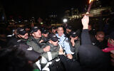 Protesters clash with police after attending a demonstration against the Benjamin Netanyahu's government,  in Tel Aviv, on January 14, 2023. (Yonatan Sindel/Flash90)