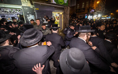 Police clash with ultra-Orthodox Jews protesting against a cellphone shop in Jerusalem's Geula neighborhood on January 16, 2023. (Yonatan Sindel/Flash90) Police clash with ultra-Orthodox Jews protesting against a cellphone shop in Jerusalem's Geula neighborhood on January 16, 2023. (Yonatan Sindel/Flash90)