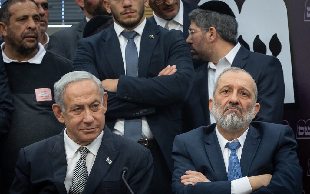 Shas leader MK Aryeh Deri (right) and Prime Minister Benjamin Netanyahu sit during a Shas party meeting at the Knesset in Jerusalem on January 23, 2023. (Yonatan Sindel/Flash90) Shas leader MK Aryeh Deri (right) and Prime Minister Benjamin Netanyahu sit during a Shas party meeting at the Knesset in Jerusalem on January 23, 2023. (Yonatan Sindel/Flash90)