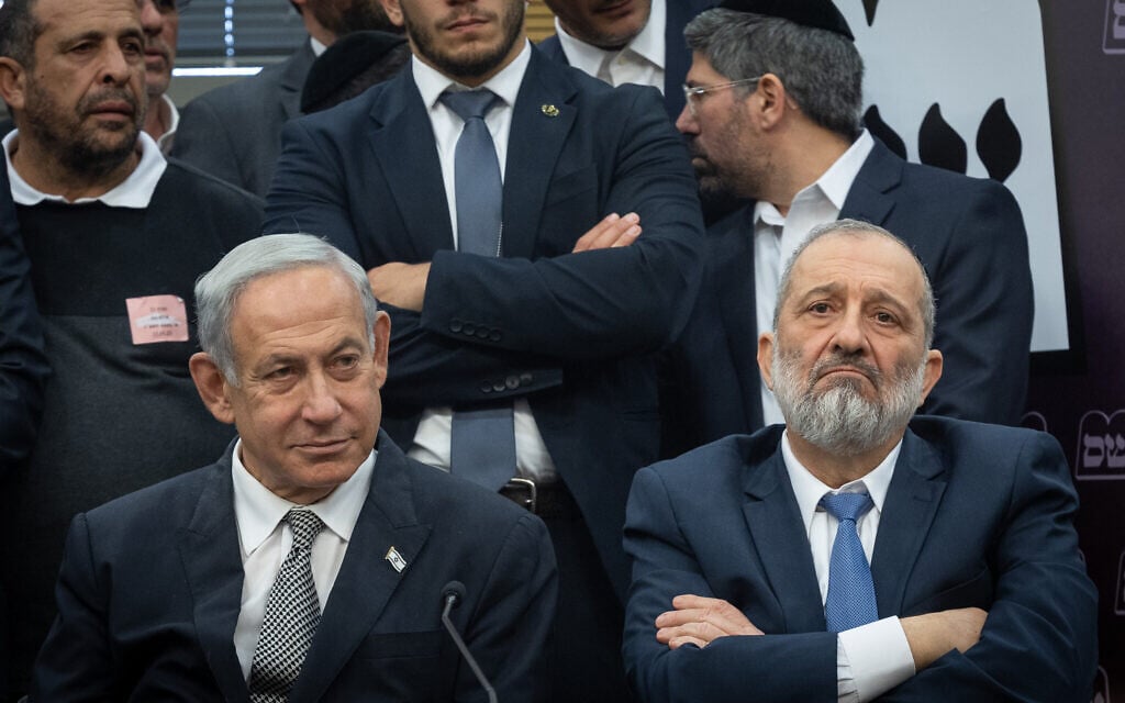 Shas leader MK Aryeh Deri, right, and Prime Minister Benjamin Netanyahu seen during a Shas party meeting at the Knesset in Jerusalem on January 23, 2023. (Yonatan Sindel/Flash90) Shas leader MK Aryeh Deri, right, and Prime Minister Benjamin Netanyahu seen during a Shas party meeting at the Knesset in Jerusalem on January 23, 2023. (Yonatan Sindel/Flash90)
