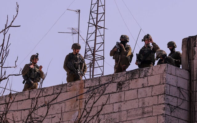 Illustrative: Israeli soldiers clash with Palestinians in the West Bank city of Hebron, January 26, 2023. (Wisam Hashlamoun/Flash90) Illustrative: Israeli soldiers clash with Palestinians in the West Bank city of Hebron, January 26, 2023. (Wisam Hashlamoun/Flash90)