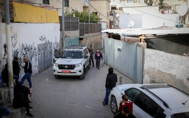 Police outside the home of the Palestinian terrorist who killed seven people in a terror attack, in Jerusalem's A-Tur neighborhood, January 28, 2023. (Jamal Awad/Flash90) Police outside the home of the Palestinian terrorist who killed seven people in a terror attack, in Jerusalem's A-Tur neighborhood, January 28, 2023. (Jamal Awad/Flash90)