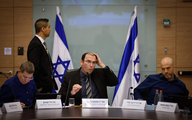 Chairman of the Knesset Constitution, Law and Justice Committee MK Simcha Rothman of the Religious Zionism party (center) with committee legal adviser Gur Bligh (right) during a committee hearing, January 29, 2023. (Olivier Fitoussi/Flash90) Chairman of the Knesset Constitution, Law and Justice Committee MK Simcha Rothman of the Religious Zionism party (center) with committee legal adviser Gur Bligh (right) during a committee hearing, January 29, 2023. (Olivier Fitoussi/Flash90)