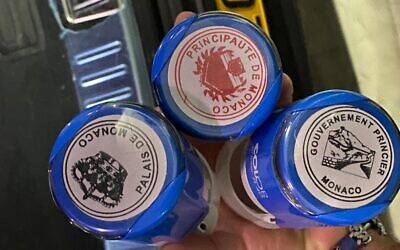 Stamps representing European principalities, such as Monaco, found by police while searching the Netanya home of a scam artist who allegedly posed as the secretary general of the Elysée Palace, the French president's official residence, January 24, 2023. (Israel Police)