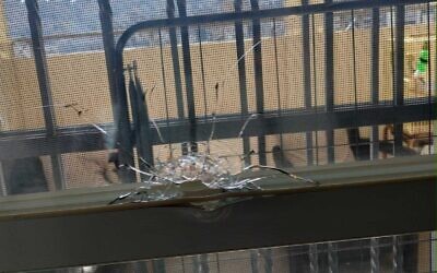 A window at a home in the Jerusalem neighborhood of Pisgat Zeev that was apparently shattered by a stray bullet on January 21, lightly wounding a seven year-old girl. (Magen David Adom)