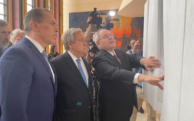 Israeli Ambassador to the UN Gilad Erdan (left), UN secretary-general Antonio Guterres (center) and Yad Vashem chairman Dani Dayan (right) at a Yad Vashem exhibit at UN Headquarters in New York on January 26, 2023. (Luke Tress/Times of Israel) Israeli Ambassador to the UN Gilad Erdan (left), UN secretary-general Antonio Guterres (center) and Yad Vashem chairman Dani Dayan (right) at a Yad Vashem exhibit at UN Headquarters in New York on January 26, 2023. (Luke Tress/Times of Israel)