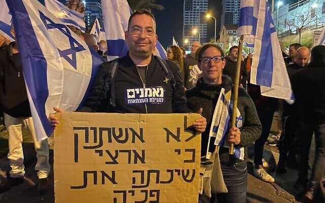 Protester Assaf Abrahamovitz speaks to The Times of Israel from an anti-government protest in Tel Aviv. (Carrie Keller-Lynn/Times of Israel)