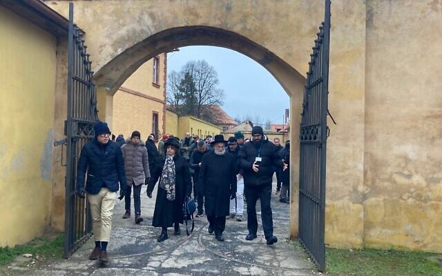 European Jewish Association delegates enter the former Theresienstadt ghetto and concentration camp, January 24, 2023. (Yaakov Schwartz/ Times of Israel)