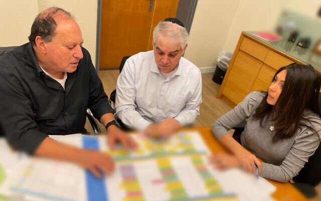 Transportation Minister Miri Regev (right) sits with Israel Railways CEO Michael Maixner (left) and Moshe Shimoni, chairman of the Israel Railways board of directors, in Jerusalem, January 11, 2023. (Transportation Minister's Office) Transportation Minister Miri Regev (right) sits with Israel Railways CEO Michael Maixner (left) and Moshe Shimoni, chairman of the Israel Railways board of directors, in Jerusalem, January 11, 2023. (Transportation Minister's Office)