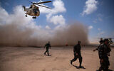 Illustrative: A helicopter flies over at the end of the African Lion military exercise, in Tantan, south of Agadir, Morocco, June 18, 2021. (AP Photo/Mosa'ab Elshamy)