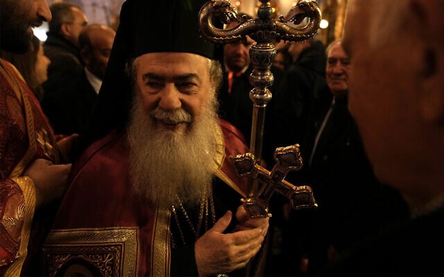 Greek Orthodox Patriarch of Jerusalem Theophilos III, center, at the Church of the Nativity during Christian Orthodox Christmas Eve in the West Bank town of Bethlehem, January 6, 2023. (AP/Nasser Nasser)