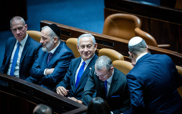 From left: Defense Minister Yoav Gallant, Interior and Health Minister Aryeh Deri, Prime Minister Benjamin Netanyahu, and Justice Minister Yariv Levin, during the swearing in ceremony of the new Israeli government at the Knesset in Jeruslaem, on December 29, 2022. (Yonatan Sindel/Flash90) From left: Defense Minister Yoav Gallant, Interior and Health Minister Aryeh Deri, Prime Minister Benjamin Netanyahu, and Justice Minister Yariv Levin, during the swearing in ceremony of the new Israeli government at the Knesset in Jeruslaem, on December 29, 2022. (Yonatan Sindel/Flash90)