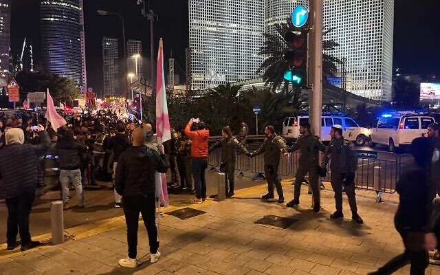 Police block off the entrance to the Ayalon Highway in Tel Aviv amid an anti-government rally, January 14, 2023. (Naomi Lanzkron/Times of Israel) Police block off the entrance to the Ayalon Highway in Tel Aviv amid an anti-government rally, January 14, 2023. (Naomi Lanzkron/Times of Israel)