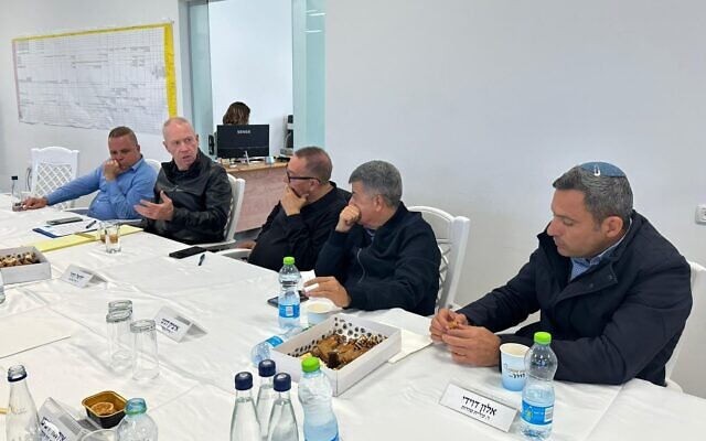 Defense Minister Yoav Gallant (second from left) meets with mayors and leaders of communities in southern Israel, in Netivot, January 17, 2023. (Courtesy)