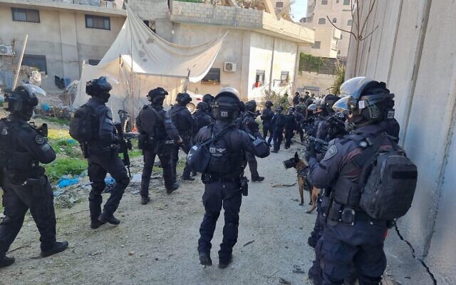 Police officers enter the Shuafat refugee camp to demolish the home of a Palestinian gunman, January 25, 2023. (Israel Police) Police officers enter the Shuafat refugee camp to demolish the home of a Palestinian gunman, January 25, 2023. (Israel Police)