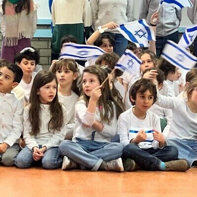 Jewish schoolchildren at Athénée Ganenou in Brussels await the arrival of President Isaac Herzog, January 25, 2023. (Lazar Berman/The Times of Israel)