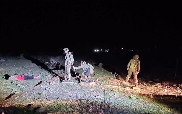 Israeli combat engineering troops extract a teenager from a minefield near Kibbutz Meitzar, January 24, 2023. (Israel Defense Forces) Israeli combat engineering troops extract a teenager from a minefield near Kibbutz Meitzar, January 24, 2023. (Israel Defense Forces)