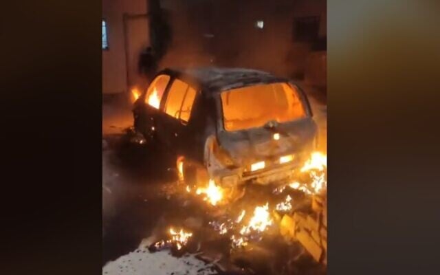 A screen capture from a video showing a car set alight by suspected Jewish settlers in the West Bank Palestinian village of Jaloud, January 29, 2023. (Twitter video screenshot: Used in accordance with Clause 27a of the Copyright Law) A screen capture from a video showing a car set alight by suspected Jewish settlers in the West Bank Palestinian village of Jaloud, January 29, 2023. (Twitter video screenshot: Used in accordance with Clause 27a of the Copyright Law)