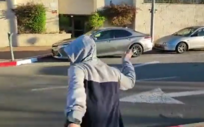 One of the suspects caught on camera while throwing eggs at anti-government protesters outside Justice Minister Yariv Levin's home in Modiin, January 19, 2022. (Twitter/Screenshot: used in accordance with Clause 27a of the Copyright Law)