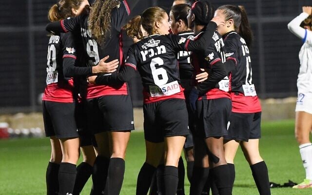 Members of the Hapoel Jerusalem women's soccer team at a recent game. (Berney Ardov/Hapoel Jerusalem)