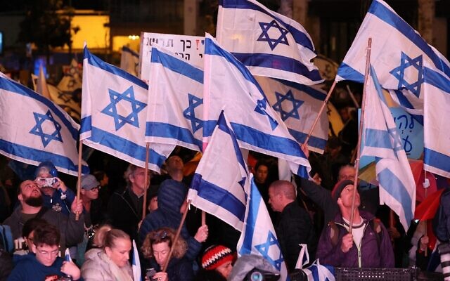 Israeli protesters attend a rally against Prime Minister Benjamin Netanyahu's new far-right government in the coastal city of Tel Aviv on February 4, 2023. (Jack Guez/AFP) Israeli protesters attend a rally against Prime Minister Benjamin Netanyahu's new far-right government in the coastal city of Tel Aviv on February 4, 2023. (Jack Guez/AFP)