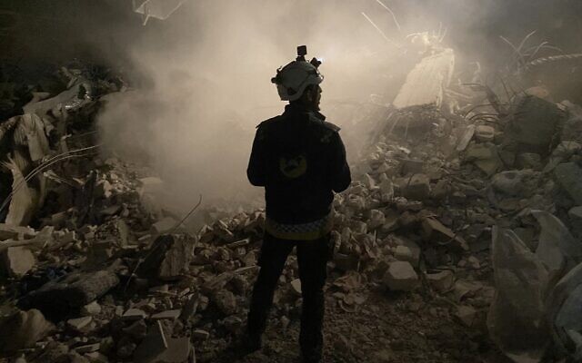 A member of the White Helmets civil defense rescue team stands in front of the rubble of a building while searching for survivors in the rebel-held Syrian town of Jindayris on February 8, 2023, two days after a deadly earthquake that hit Turkey and Syria. (AFP) A member of the White Helmets civil defense rescue team stands in front of the rubble of a building while searching for survivors in the rebel-held Syrian town of Jindayris on February 8, 2023, two days after a deadly earthquake that hit Turkey and Syria. (AFP)